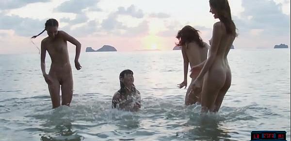  Four pretty lesbian girlfriends get naked on the beach